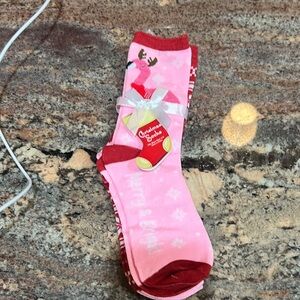 2 pairs of holiday socks, 1 pair has a flamingo, the other a holiday design NWT